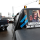A sign comparing Governor Whitmer to Adolf Hitler at a protest in Michigan on April 15, 2020.